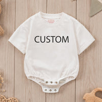 Custom baby romper with bold text print, soft cotton for sensitive skin, matching family outfit for birthdays, holidays, or baby showers