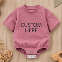 Custom baby romper with bold text print, soft cotton for sensitive skin, matching family outfit for birthdays, holidays, or baby showers