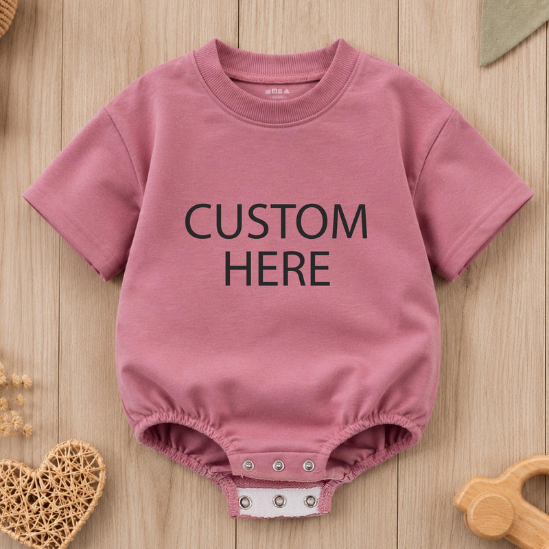 Custom baby romper with bold text print, soft cotton for sensitive skin, matching family outfit for birthdays, holidays, or baby showers