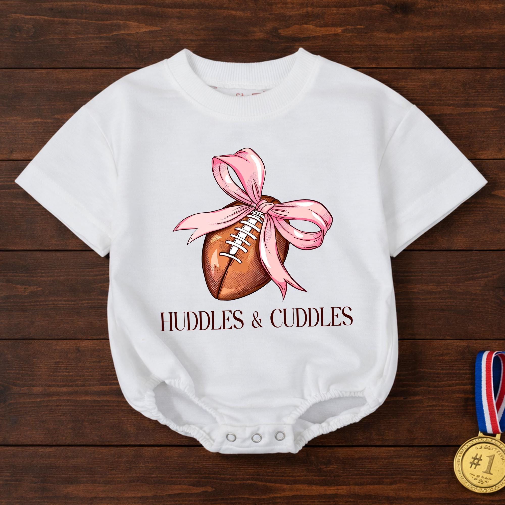Huddles and Cuddles Baby Girl Football Romper with Pink Bow Artwork, Newborn Gift for Baby Shower or First Photoshoot Outfit