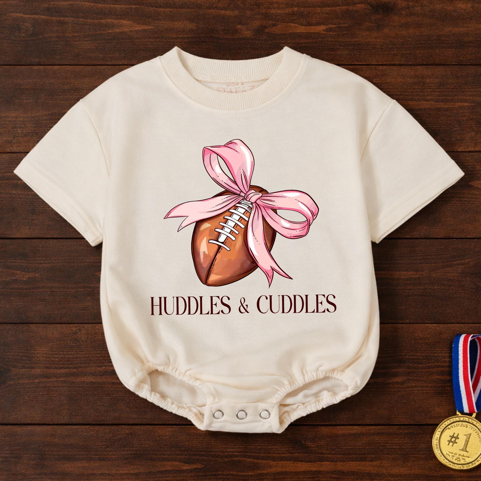 Huddles and Cuddles Baby Girl Football Romper with Pink Bow Artwork, Newborn Gift for Baby Shower or First Photoshoot Outfit