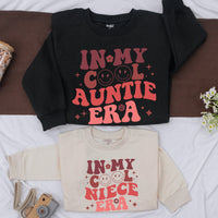 In My Cool Auntie Era Retro Sweatshirt Fun Gift for Trendy Aunts Colorful Design with Smiley Faces Ideal for Baby Showers Sister Gifts