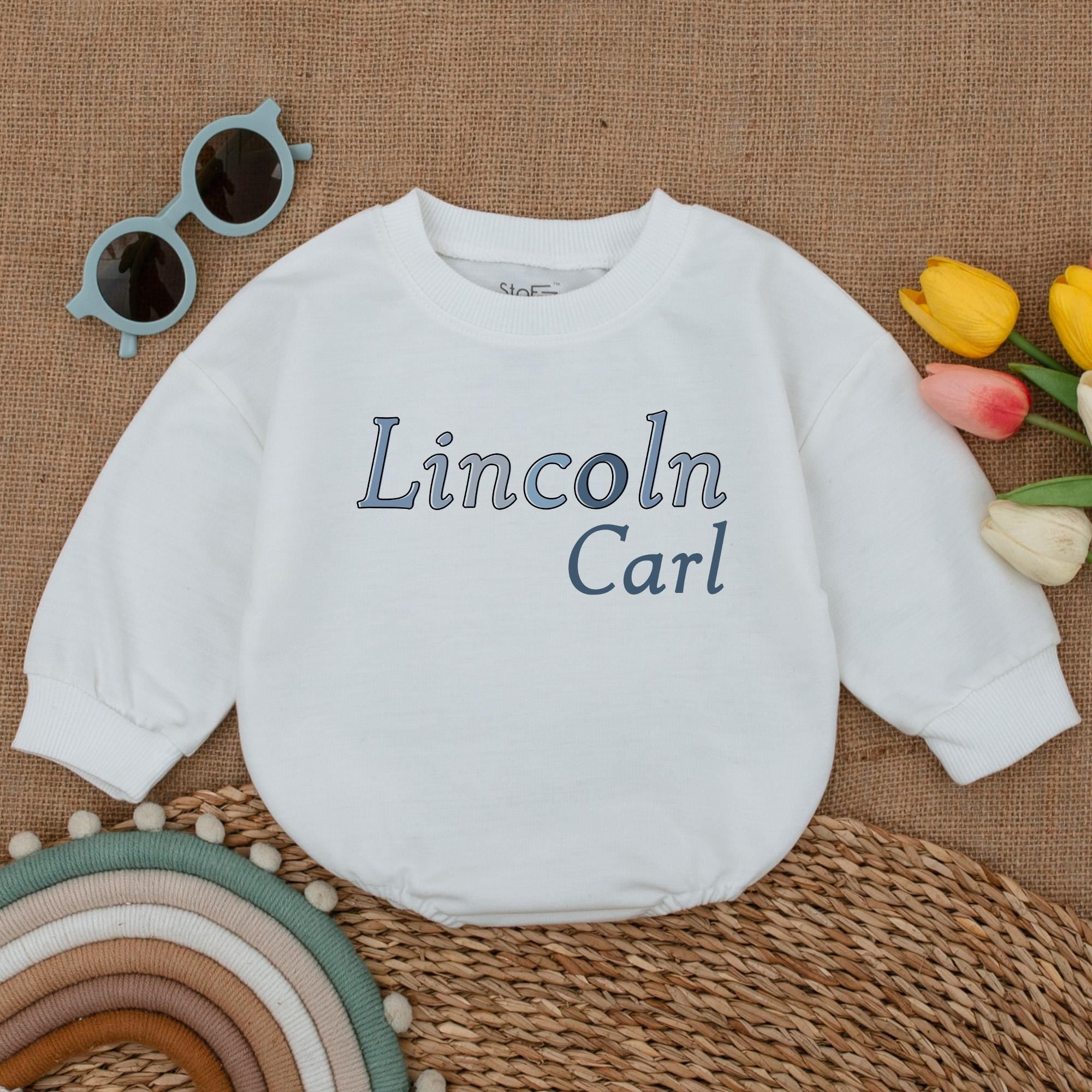 Personalized Name Boy Bubble Romper Big Brother Sweatshirt Matching Sibling Family Clothes Soft Blue Text Cream Background Baby Outfit
