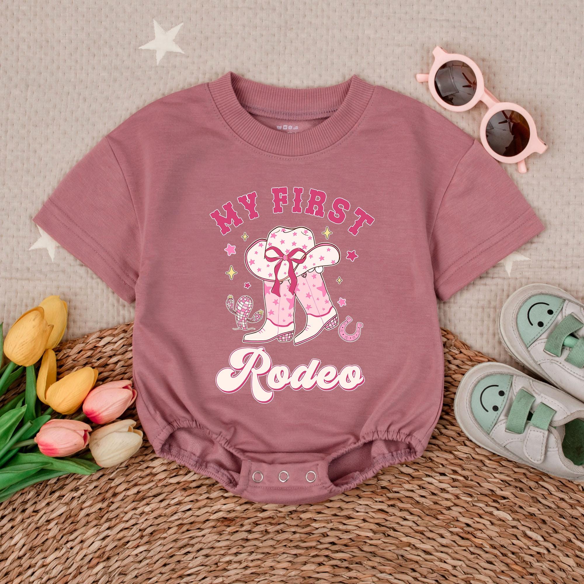 Girl's My First Rodeo Baby Romper with Pink Cowboy Design