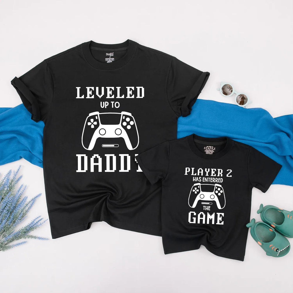 Matching Gamer Shirts for Dad and Baby with Pixelated Text Design New Dad Gift Leveled Up to Daddy and Player 2 Father's Day Outfit
