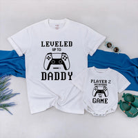 Matching Gamer Shirts for Dad and Baby with Pixelated Text Design New Dad Gift Leveled Up to Daddy and Player 2 Father's Day Outfit
