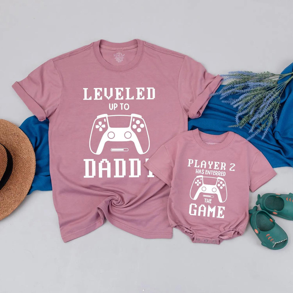 Matching Gamer Shirts for Dad and Baby with Pixelated Text Design New Dad Gift Leveled Up to Daddy and Player 2 Father's Day Outfit