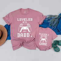 Matching Gamer Shirts for Dad and Baby with Pixelated Text Design New Dad Gift Leveled Up to Daddy and Player 2 Father's Day Outfit