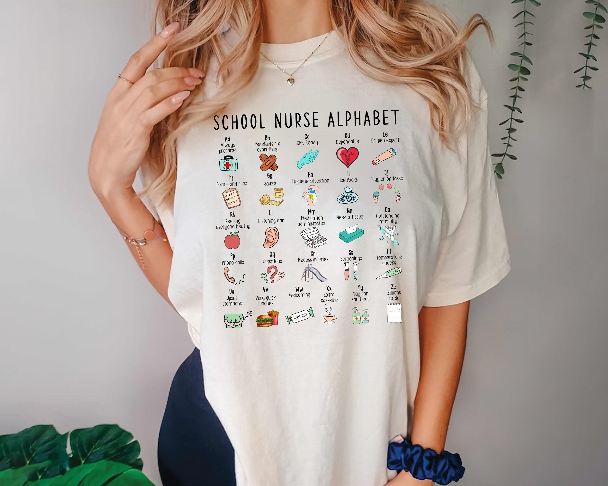 School Nurse Alphabet Shirt with Nursing Icons Educational ABC Design Pastel Colors Comfortable Gift for Nurses Appreciation or Workwear